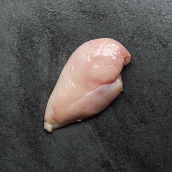 Overhead shot of a raw boneless, skinless chicken breast.