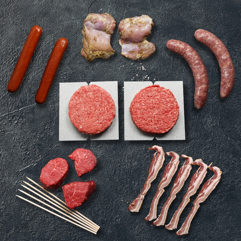 Overhead image of Cottage Box - burgers, sausages, bacon, and more.