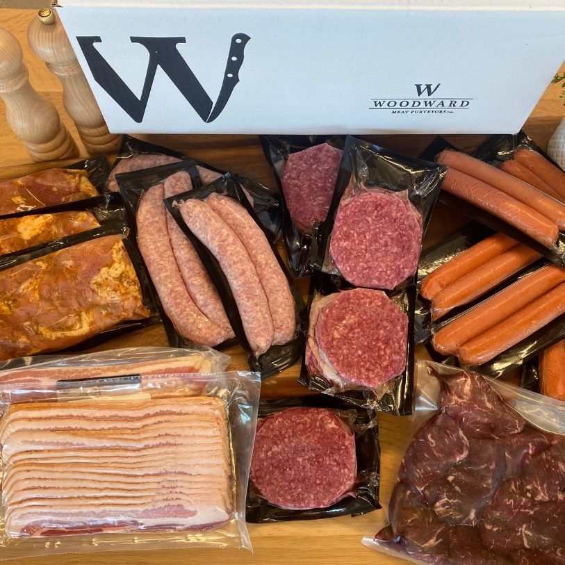 Overhead image of Cottage Box - burgers, sausages, bacon, and more.