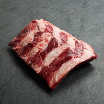 overhead view of a halved rack of raw beef back ribs