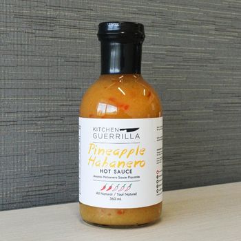 glass bottle of pineapple habanero hot sauce