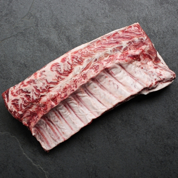 Overhead view of a whole Spanish Iberico Pork Rack