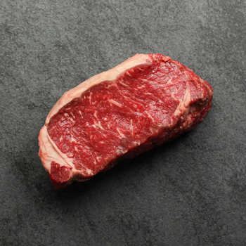 Overhead view of a raw New York steak.