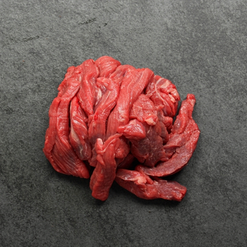 Overhead view of beef stir fry slices.
