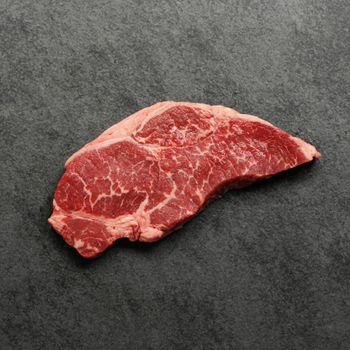 Overhead view of a raw sandwich steak.
