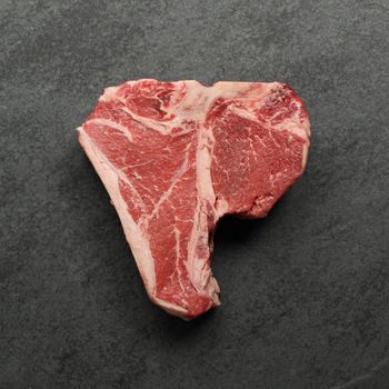 overhead image of a raw T-bone steak