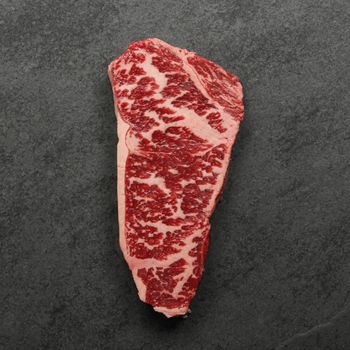 overhead image of a heavily marbled Australian wagyu new york steak