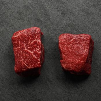 overhead view of two well-marbled sirloin steaks