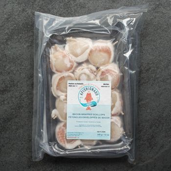 overhead view of vacuum-packed, frozen, raw bacon-wrapped scallops