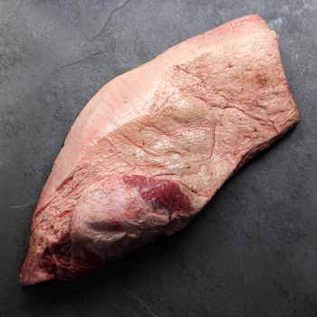 overhead image of the fatty side of a raw beef brisket