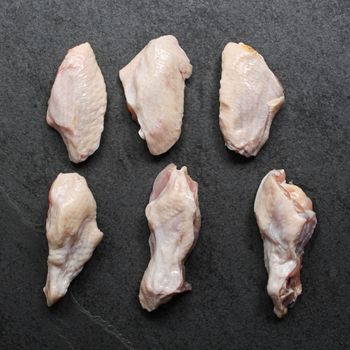 overhead view of raw chicken wings - drums and flats