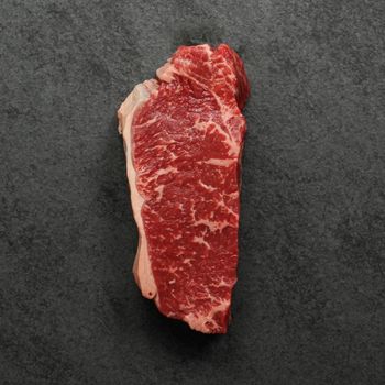 overhead view of a raw grass fed new york steak