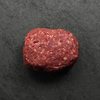 Overhead view of a 1 lb ball of raw lean ground beef