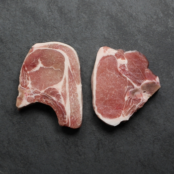 Overhead image of uncooked bone-in pork chop sourced in Canada.