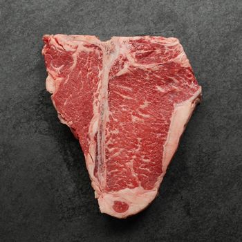 Overhead view of raw t-bone steak.