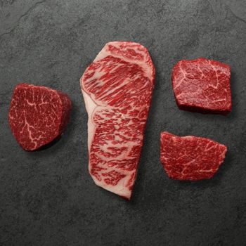 overhead view of 4 different wagyu steaks