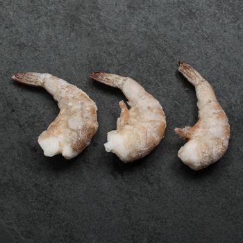 Overhead image of frozen jumbo sized pacific white shrimp
