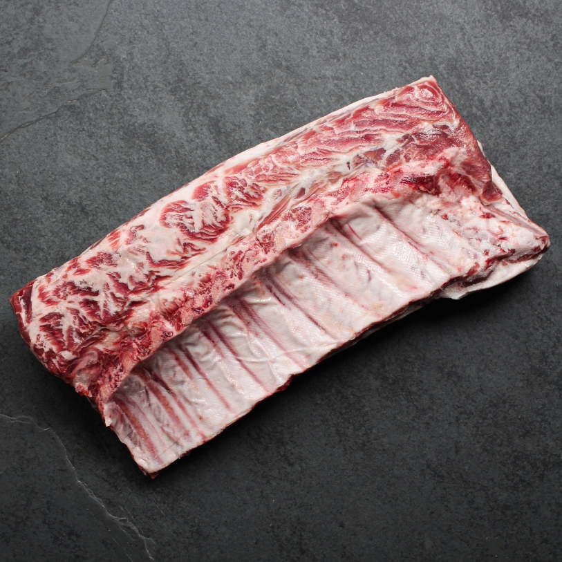 Overhead view of a whole Spanish Iberico Pork Rack.