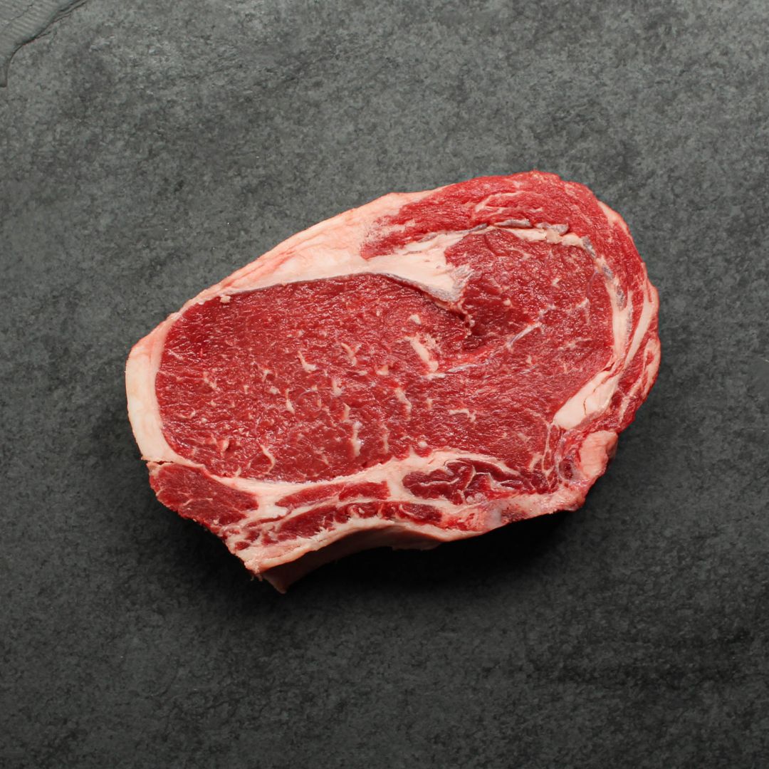 Overhead view of raw bone in rib steak.