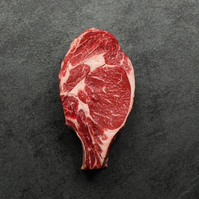 Overhead view of raw bone in rib steak.