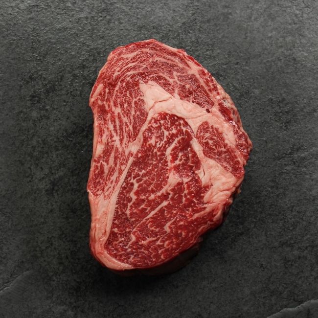 overhead view of a heavily marbled Australian wagyu rib eye steak