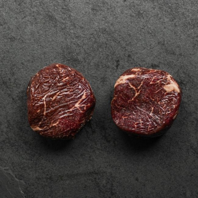 overhead view of two raw Australian wagyu beef sirloin steaks