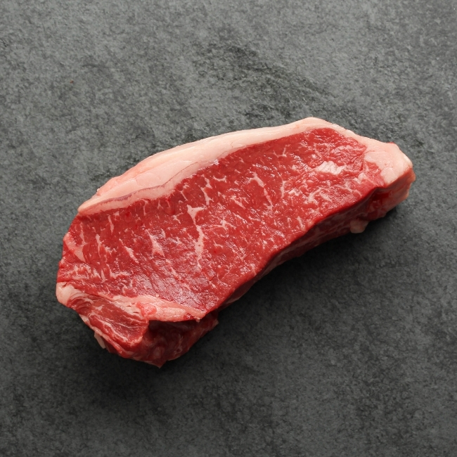 Overhead view of a raw New York steak.