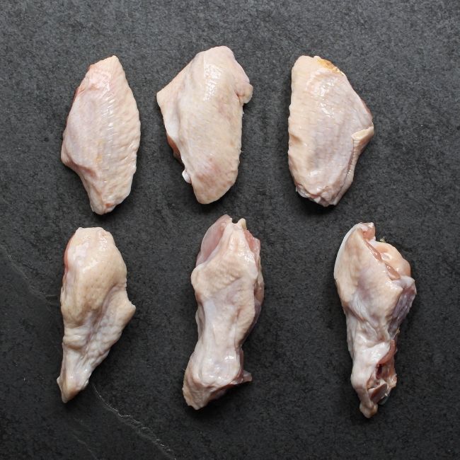 overhead view of raw chicken wings - drums and flats