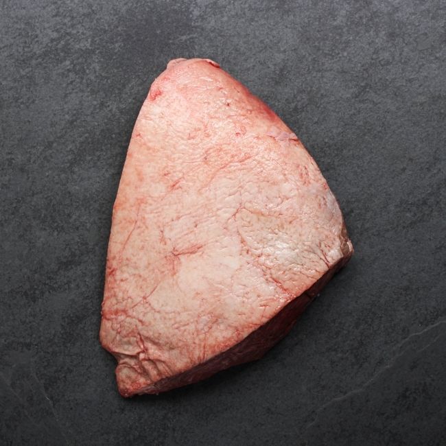 overhead image of the fat cap side of a whole raw picanha roast