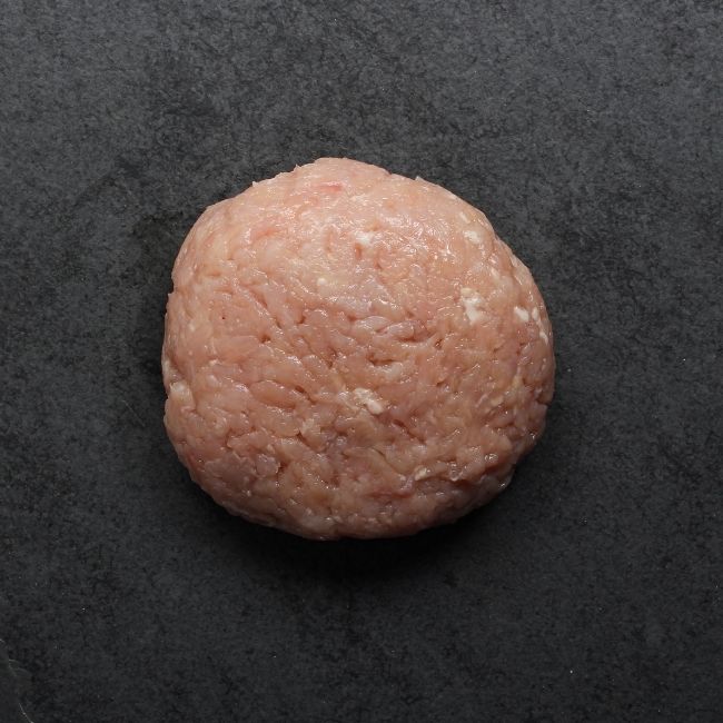 overhead image of a 1 lb ball of raw ground chicken