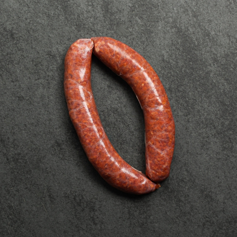 Overhead image of house-made Iberico pork chorizo sausages, uncooked and gluten-free.