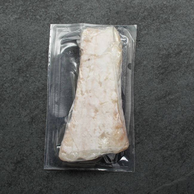 overhead view of a vacuum-packaged piece of frozen Icelandic cod