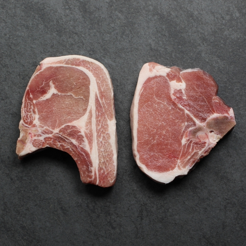 Overhead image of uncooked bone-in pork chop sourced in Canada.