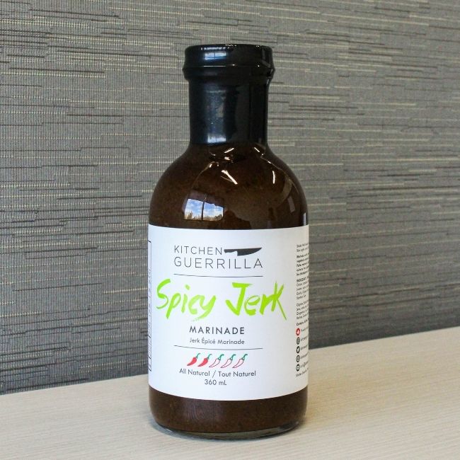 glass bottle of a spicy jerk marinade