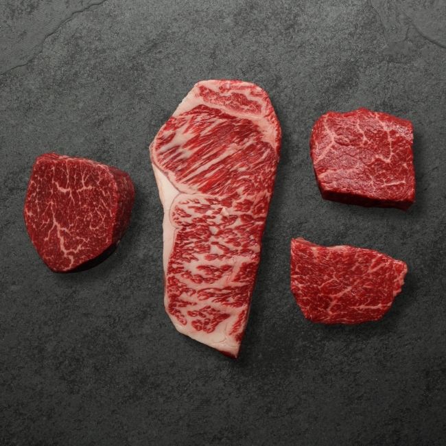 overhead view of 4 different wagyu steaks