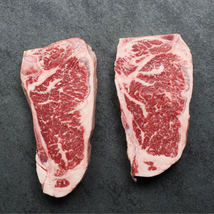 Overhead of Prime Beef New York Bone-In Steak