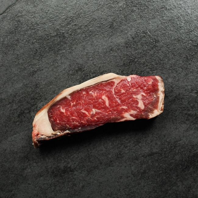 Overhead view of dry aged New York steak.
