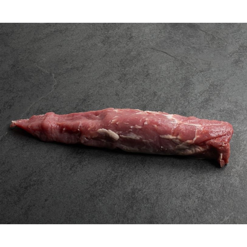 angled view of a whole raw pork tenderloin