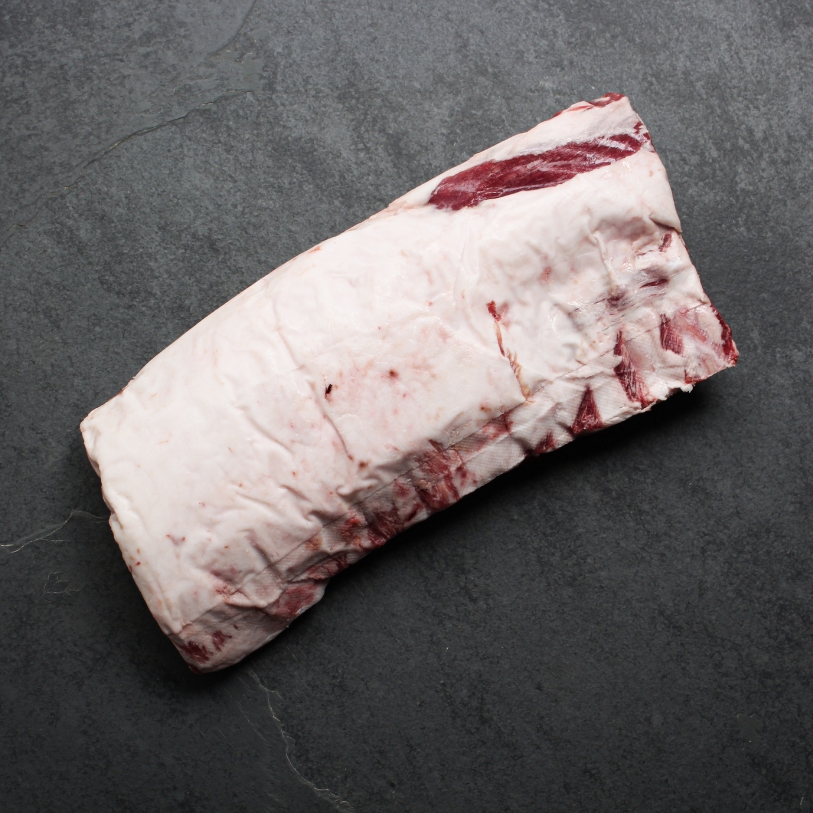 Overhead view of a whole Spanish Iberico Pork Rack