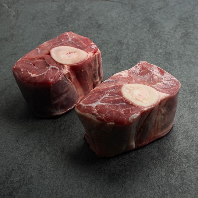 angled view of w raw pieces of veal osso buco