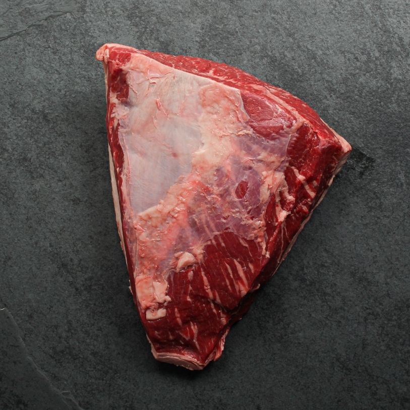 overhead view of the flesh side of a raw AAA beef picanha roast