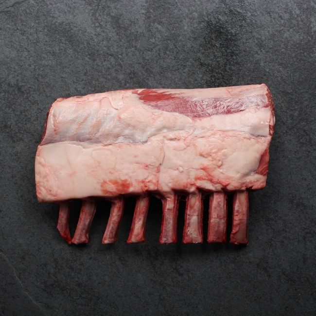 overhead image of the fatty side of an Australian raw rack of lamb