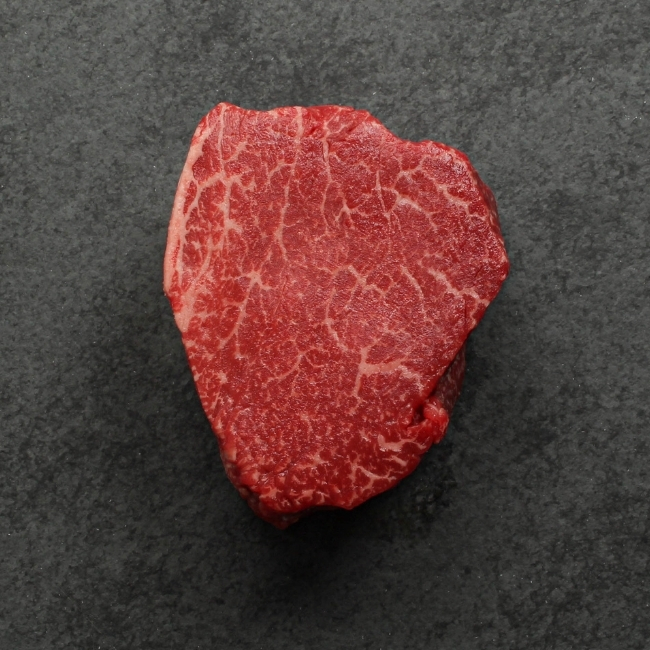 overhead view of the underside of a heavily marbled australian wagyu filet mignon