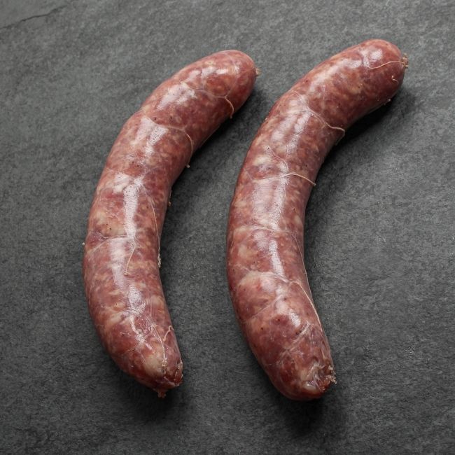 close-up angled view of two mild Italian sausages