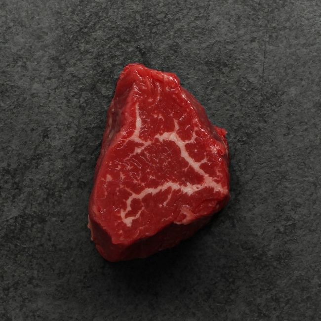 overhead view of a raw American-Wagyu Hybrid 4 oz filet mignon
