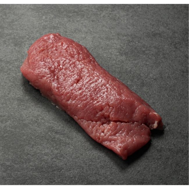 angled view of a raw veal cutelet
