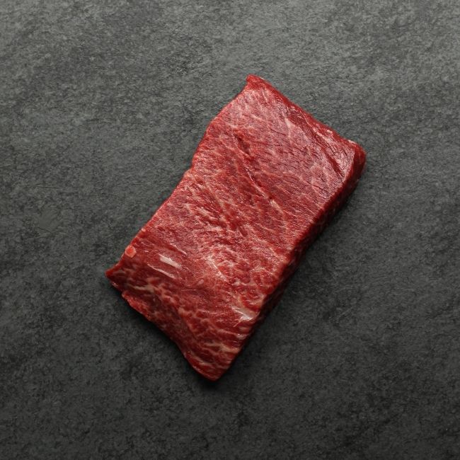 Bottom side of a raw flat iron steak.