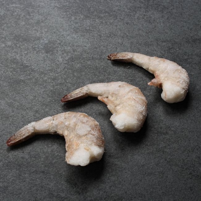 Overhead image of frozen jumbo sized pacific white shrimp