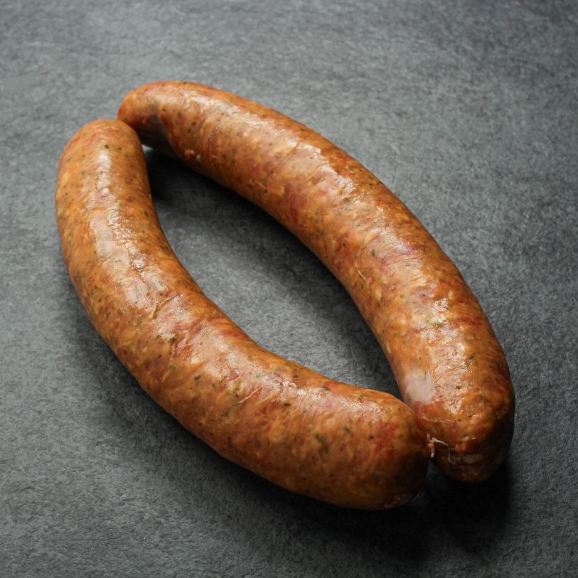 angled view of two raw european-style sausages