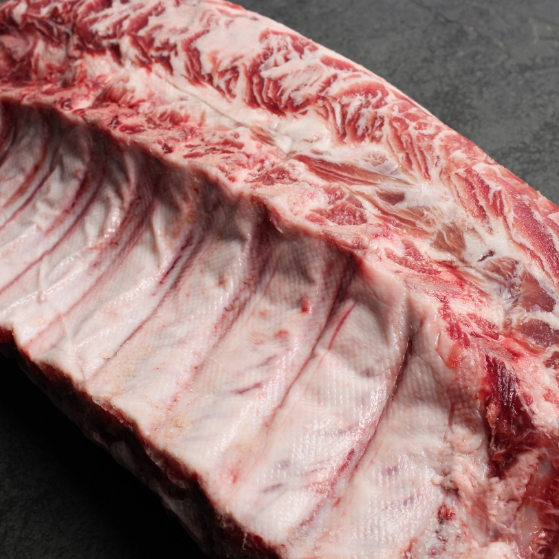 Overhead view of a whole Spanish Iberico Pork Rack